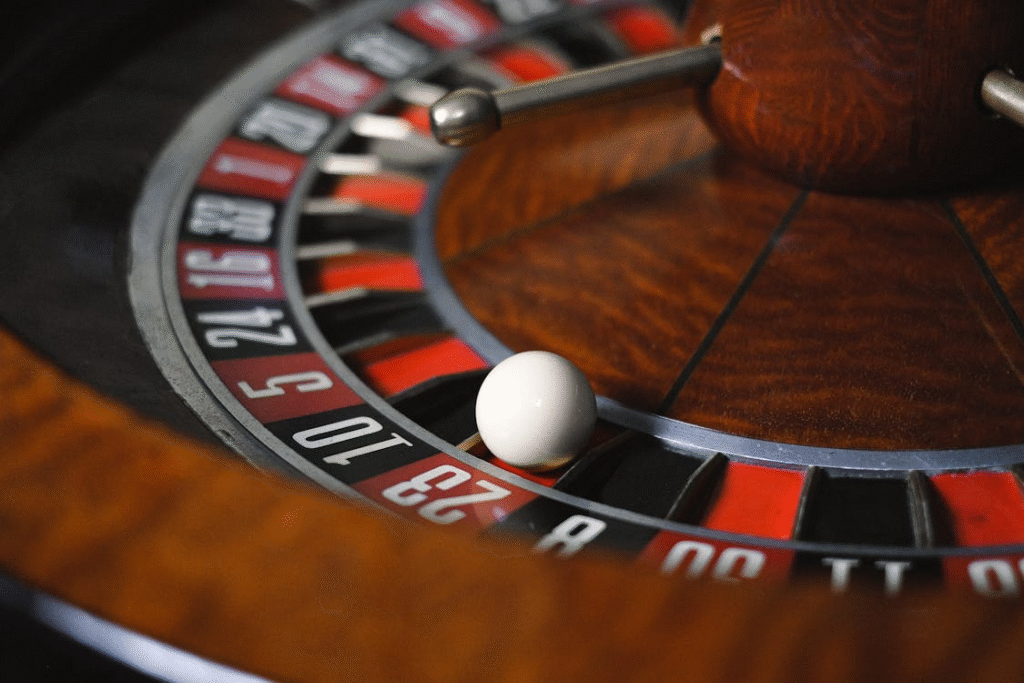 Close-up of a roulette wheel spinning under elegant event lighting