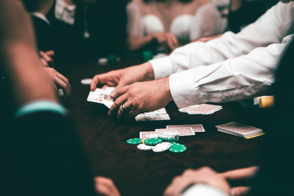 Guests gathered around a poker table